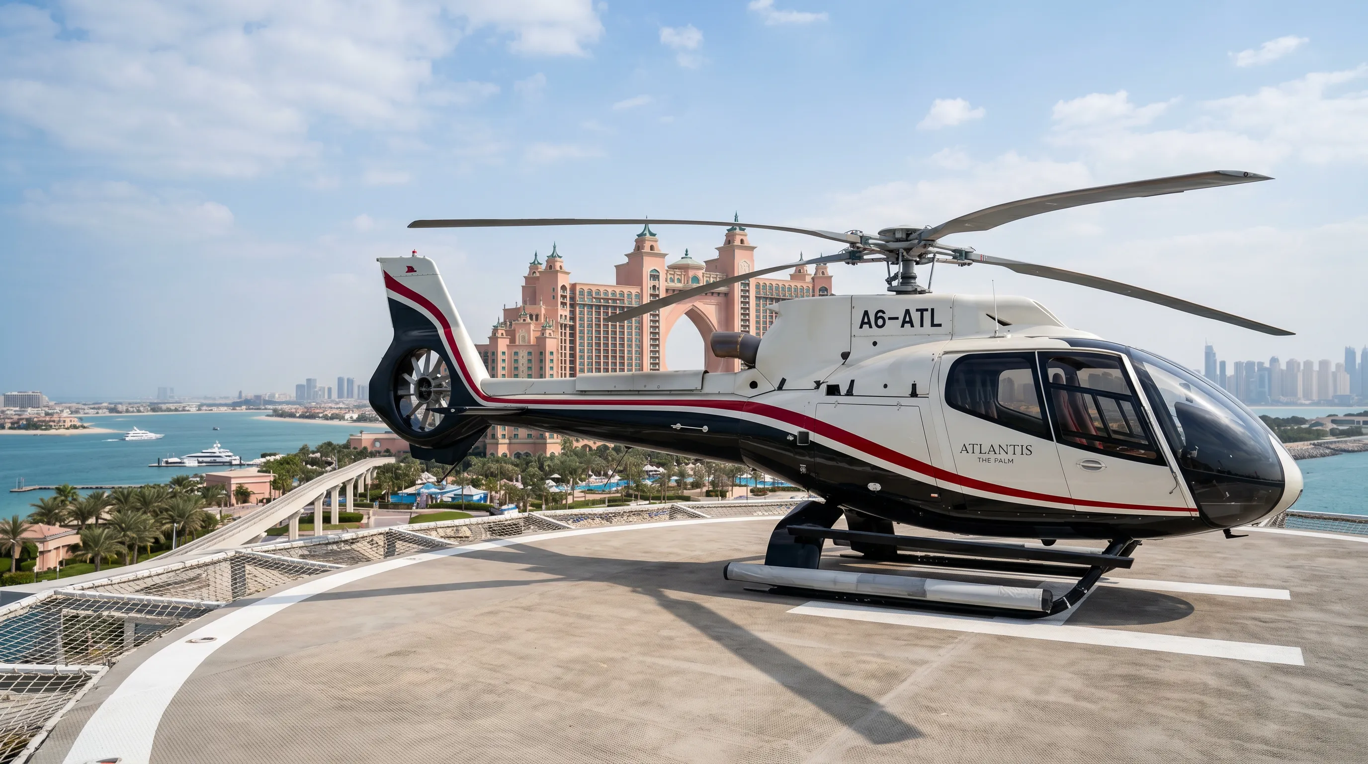Navy-blue and gold helicopter on the Atlantis helipad at the Palm Jumeirah, Dubai
