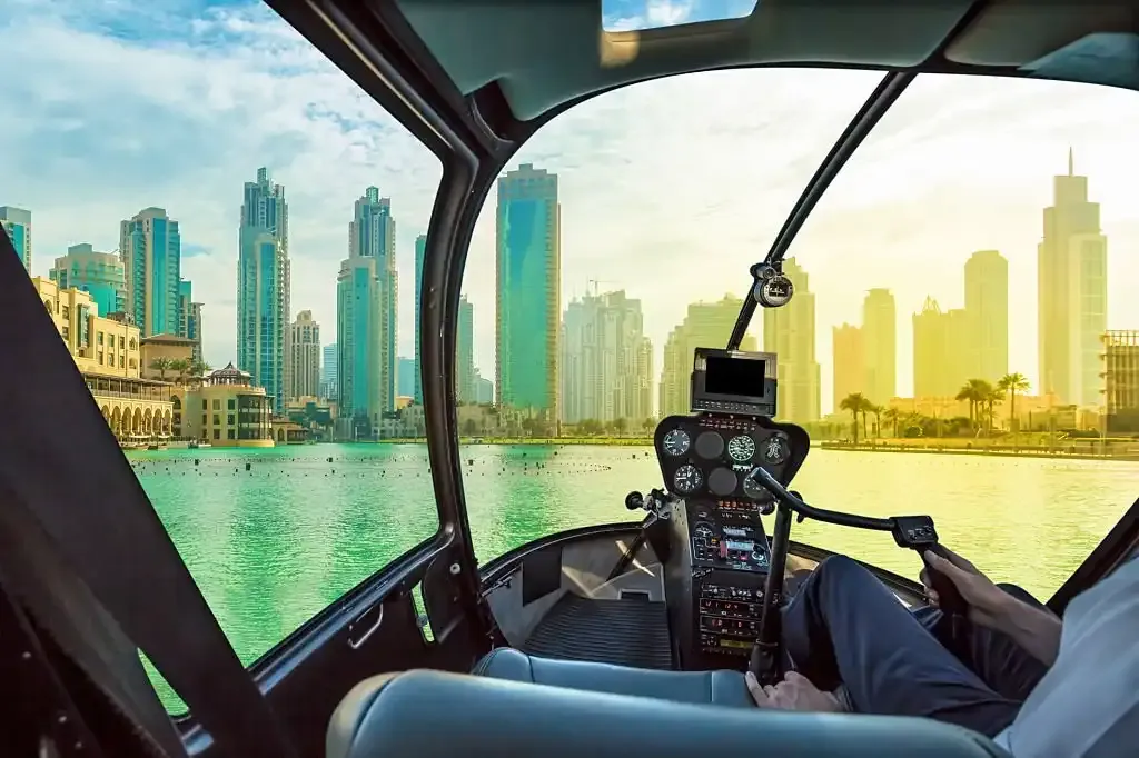 Helicopter Ride Dubai blue and gold helicopter on the apron
